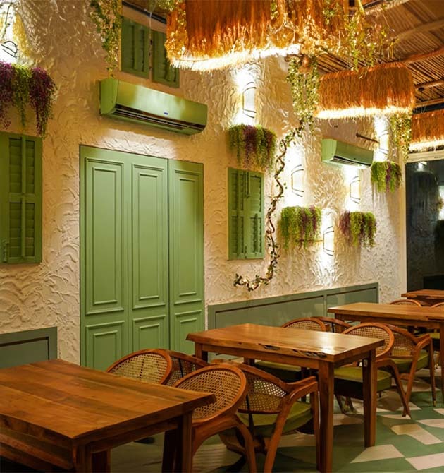 Planting and lighting along the wall of the Green Mama cafe.